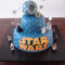 A Star Wars Themed Cake On Top Of A Wooden Table verwandt mit Star Wars Torte
