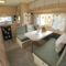 The Inside Of A Camper With Two Couches And A Dining Table In It in Ideen Wohnwagen Innen